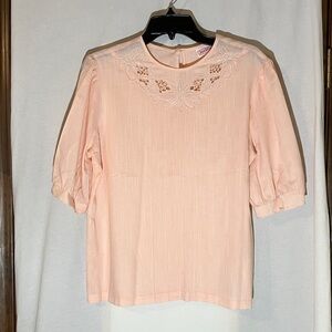 Elegant Pink Women's Top with cut work, pintucks, and gathered sleeves
